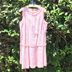 Sleeveless, drop waist fully lined dress.